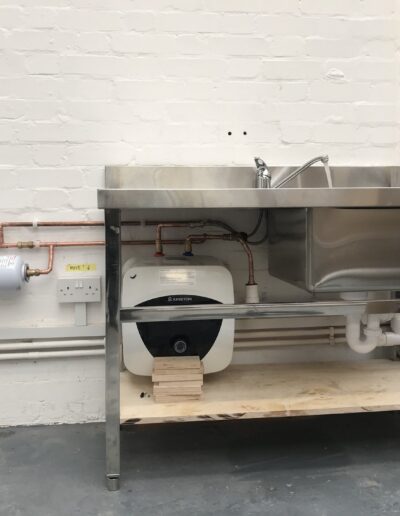 Ariston undersink water heater plumbed to a commercial stainless steel sink