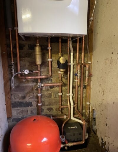 Boiler with MagnaClean filter, brass pump and red expansion vessel