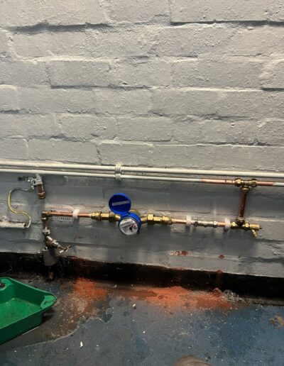 Water meter and stopcock fitted to mains pipework